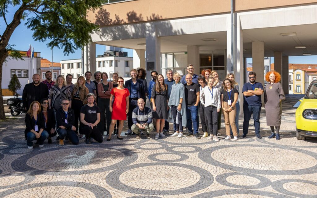 group of people in front of atlas library in aveiro