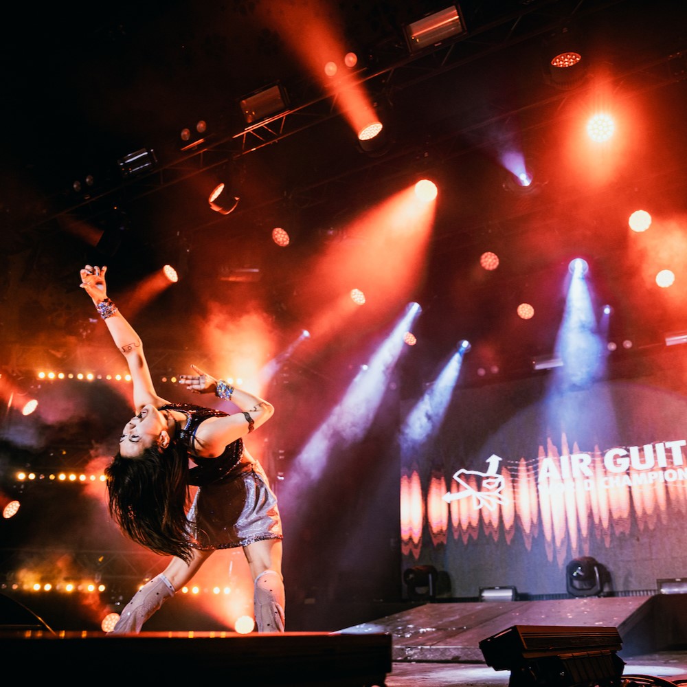 The 2023 Air Guitar World Champion Seven Seas perform on stage