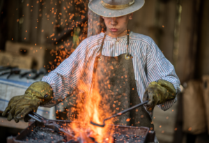 man standing against fire