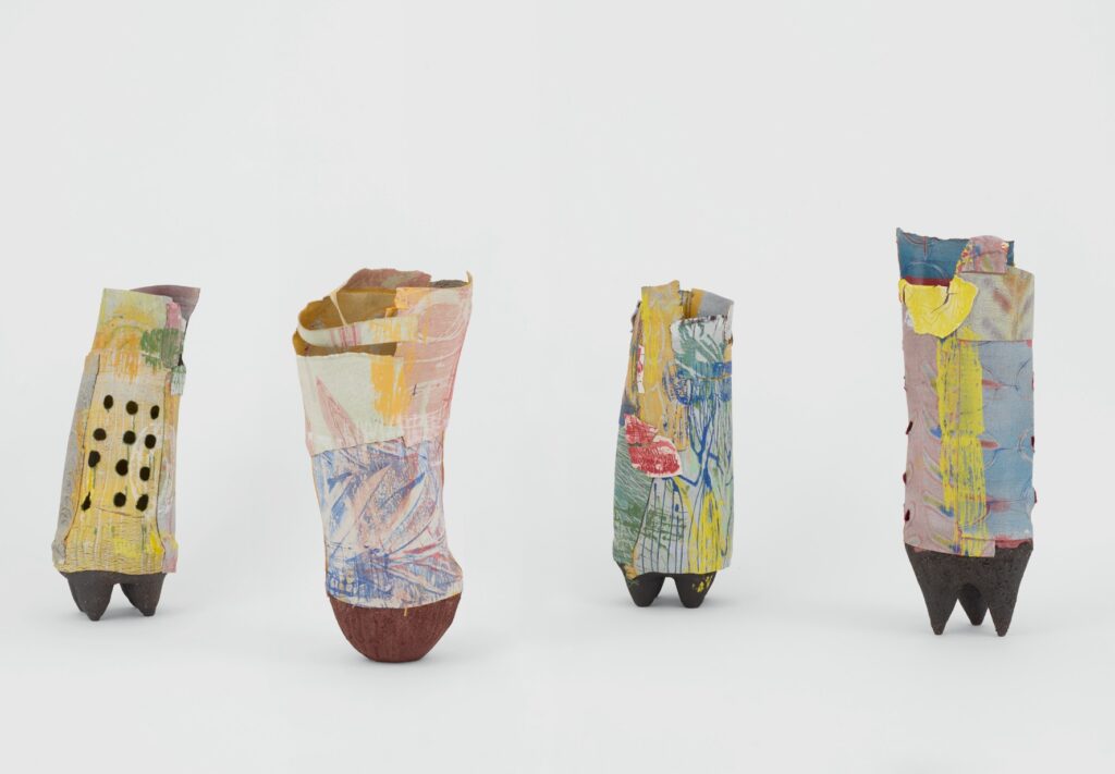 Colorful abstract sculptures with textured patterns.